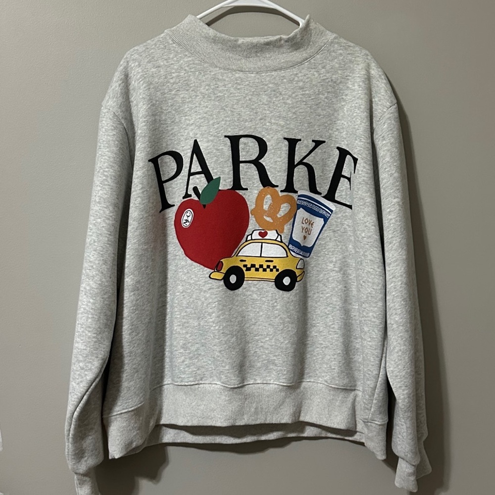 PARKE LIMITED EDITION Graphic Sweatshirt with Apple and Taxi Design